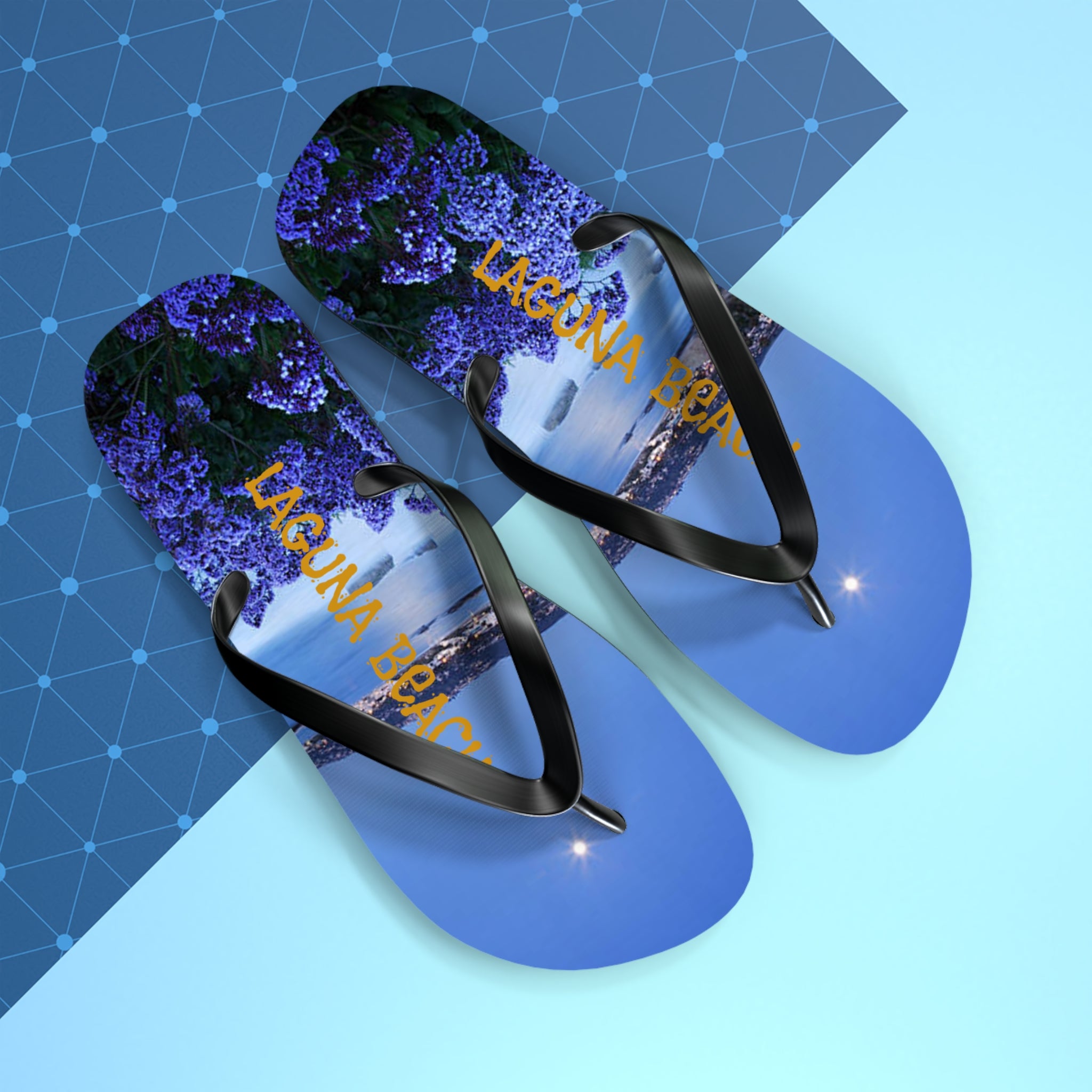 Flip-flops with "Laguna Beach" text over a floral and coastal scene.
