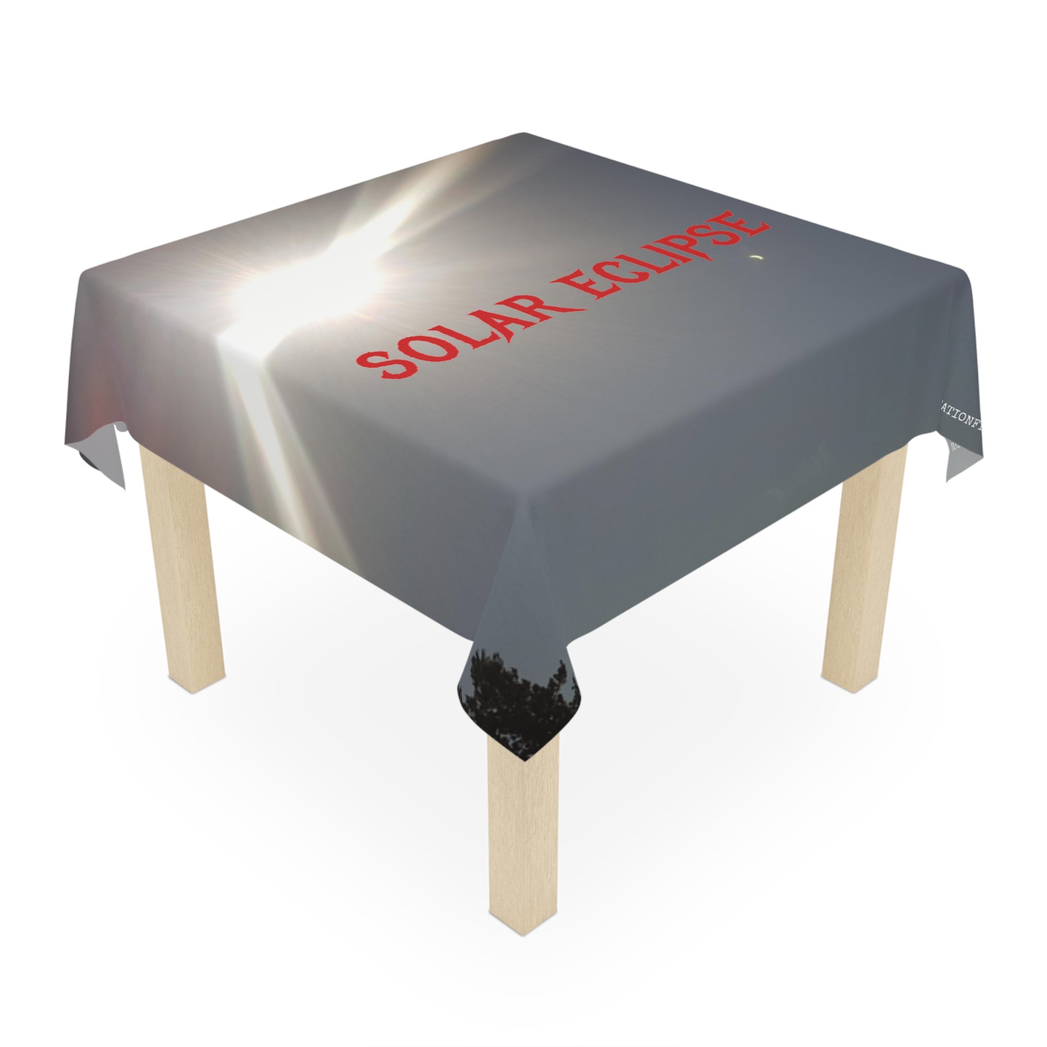 Tablecloth with "SOLAR ECLIPSE" text and sun glare.