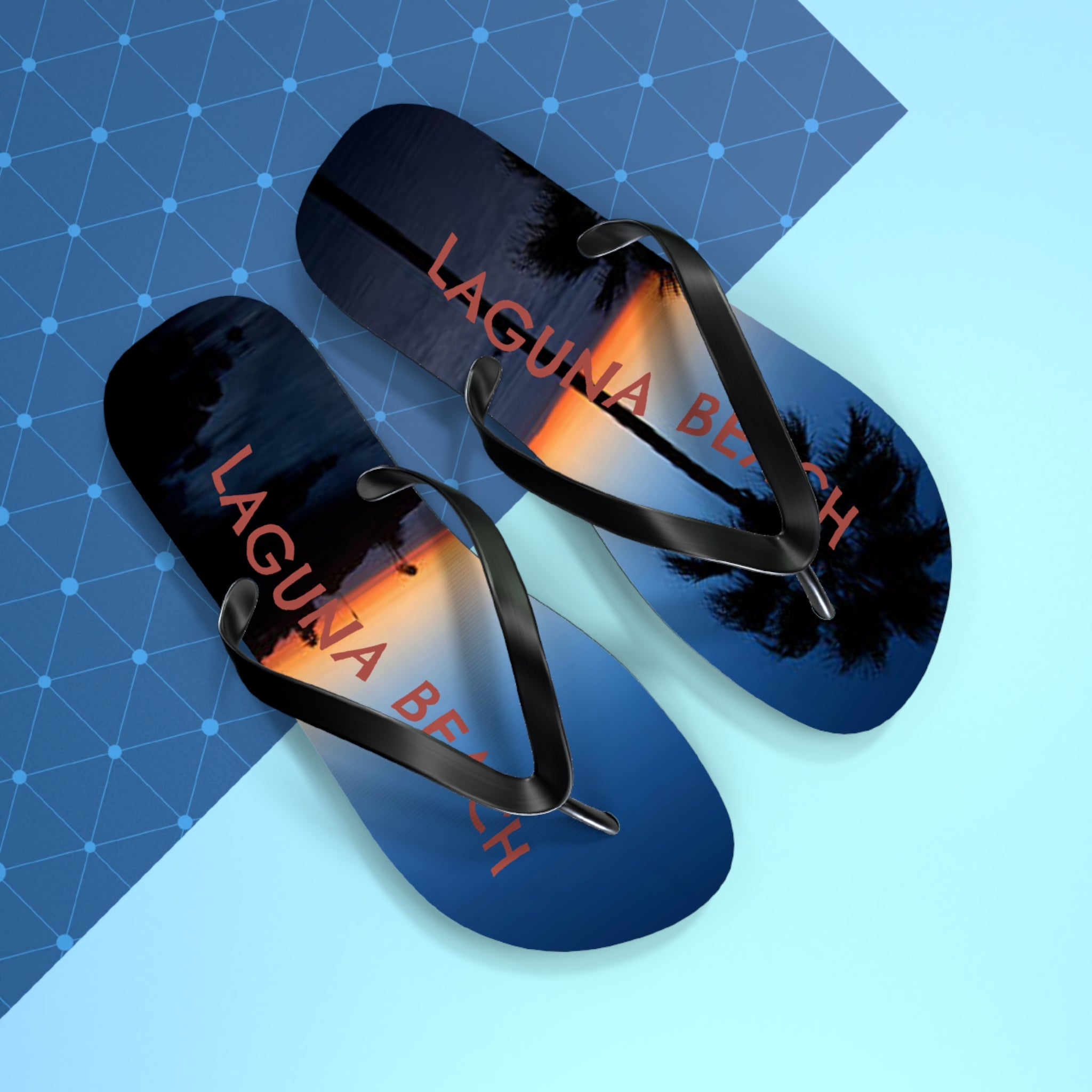 Flip flops with "Laguna Beach" text and sunset palm tree design.