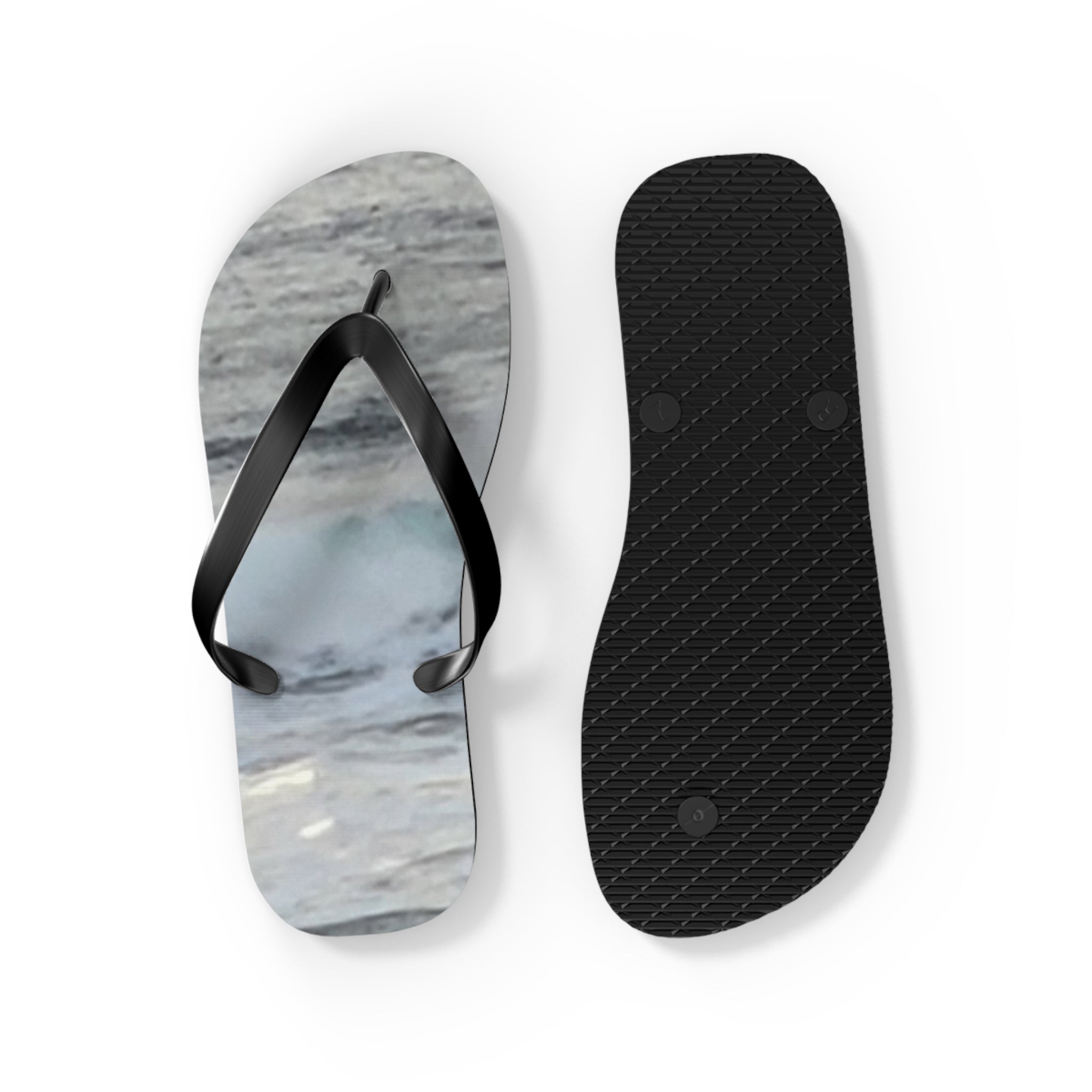 Flip-flops with a wave pattern on the sole and a black strap.