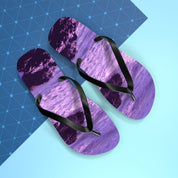 Purple flip-flops with a purple ocean wave pattern.