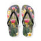 Flip-flops featuring pink tulips and yellow flowers in a garden.