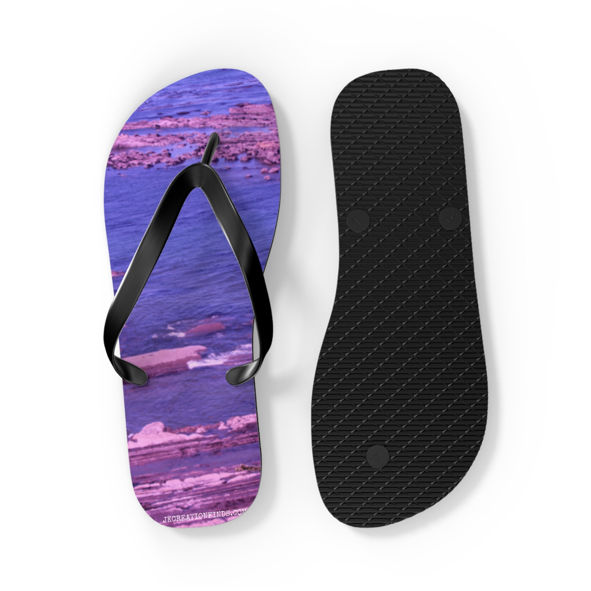 Purple abstract pattern flip-flops with black straps and black sole.