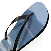 Flip-flops with a blurry blue and white abstract wave pattern.
