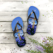 Flip-flops with a scenic night view of Laguna Beach and purple flowers.