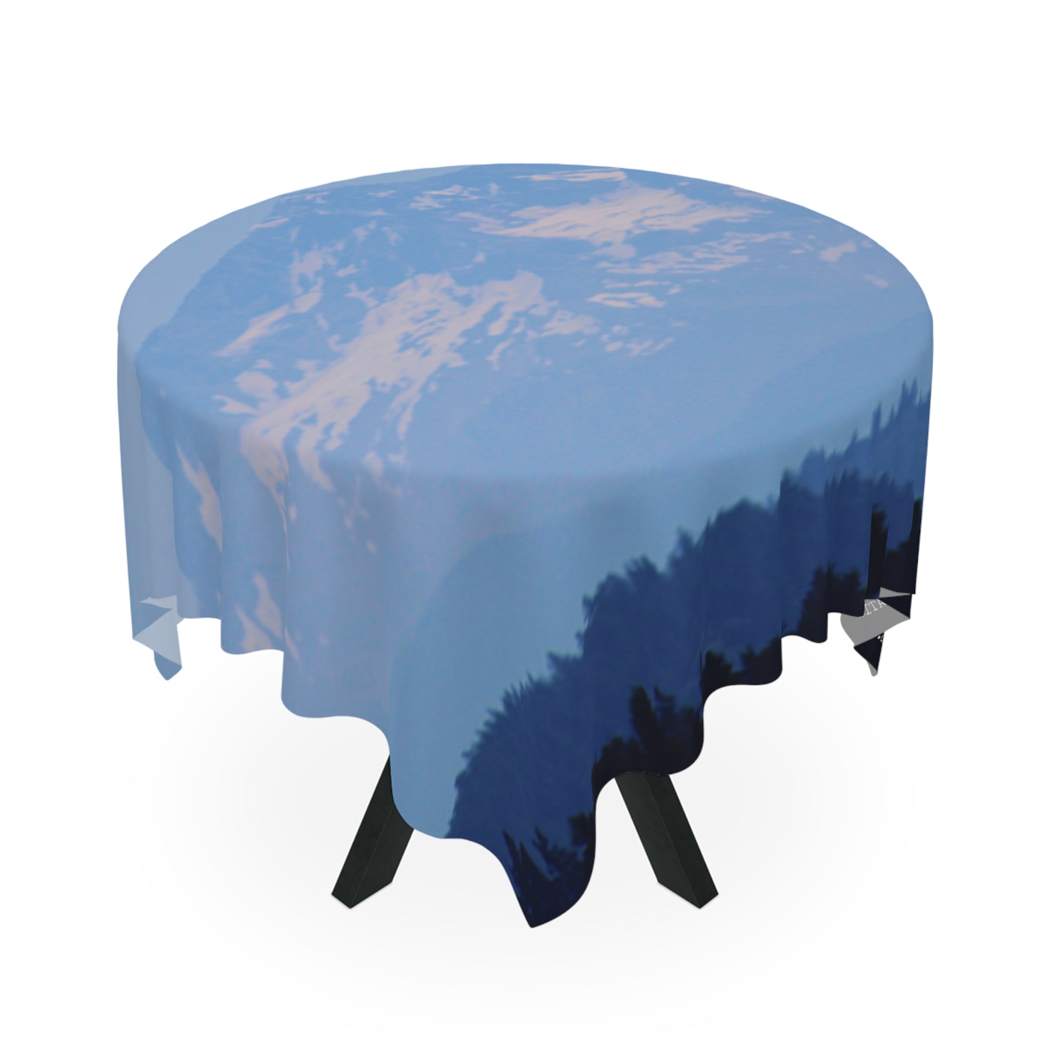 Round tablecloth featuring a scenic mountain and forest landscape.