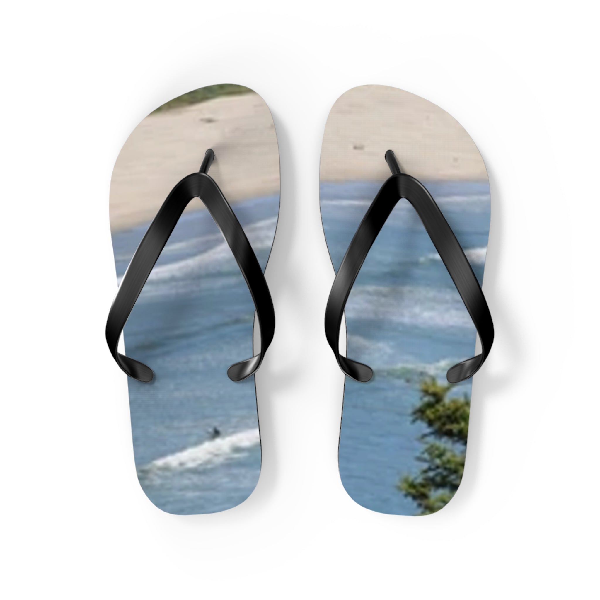 Flip-flops with a beach and ocean wave design.