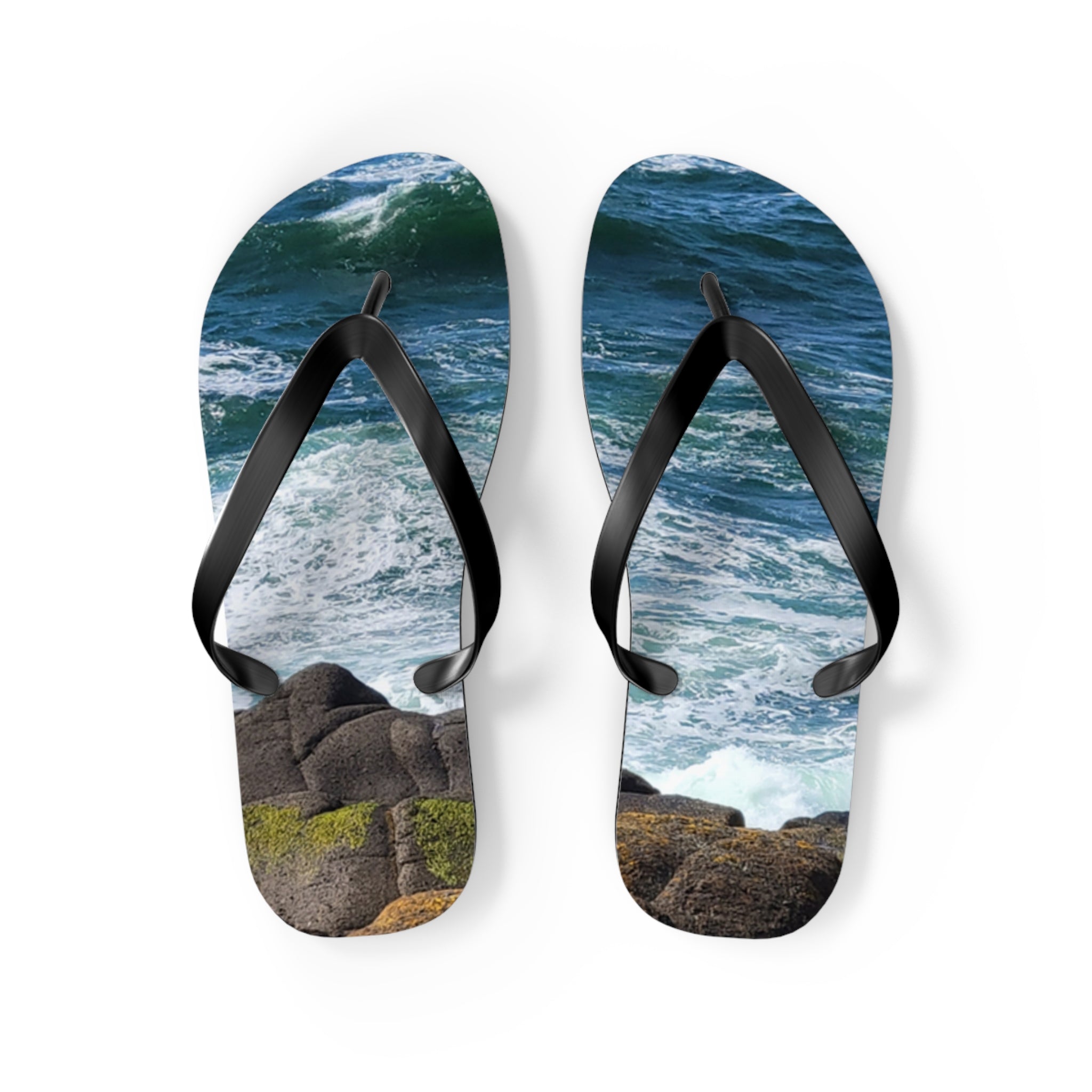 Flip-flops with ocean waves and rocky shoreline graphic.