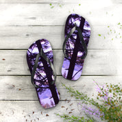 Flip-flops with a serene forest and lake scene printed on the soles.