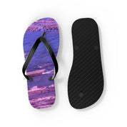 Purple patterned flip-flops with black straps and textured sole.