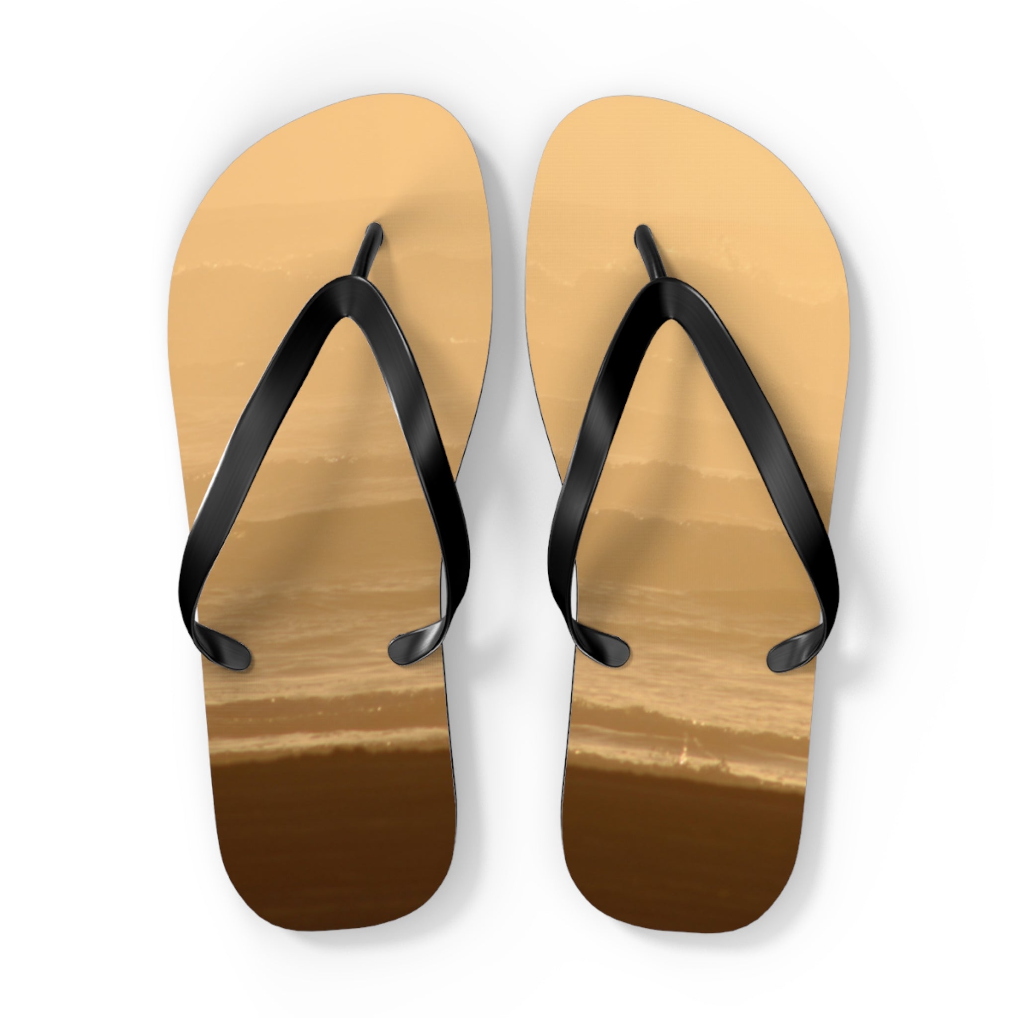 Two flip-flops with ocean wave pattern on soles.