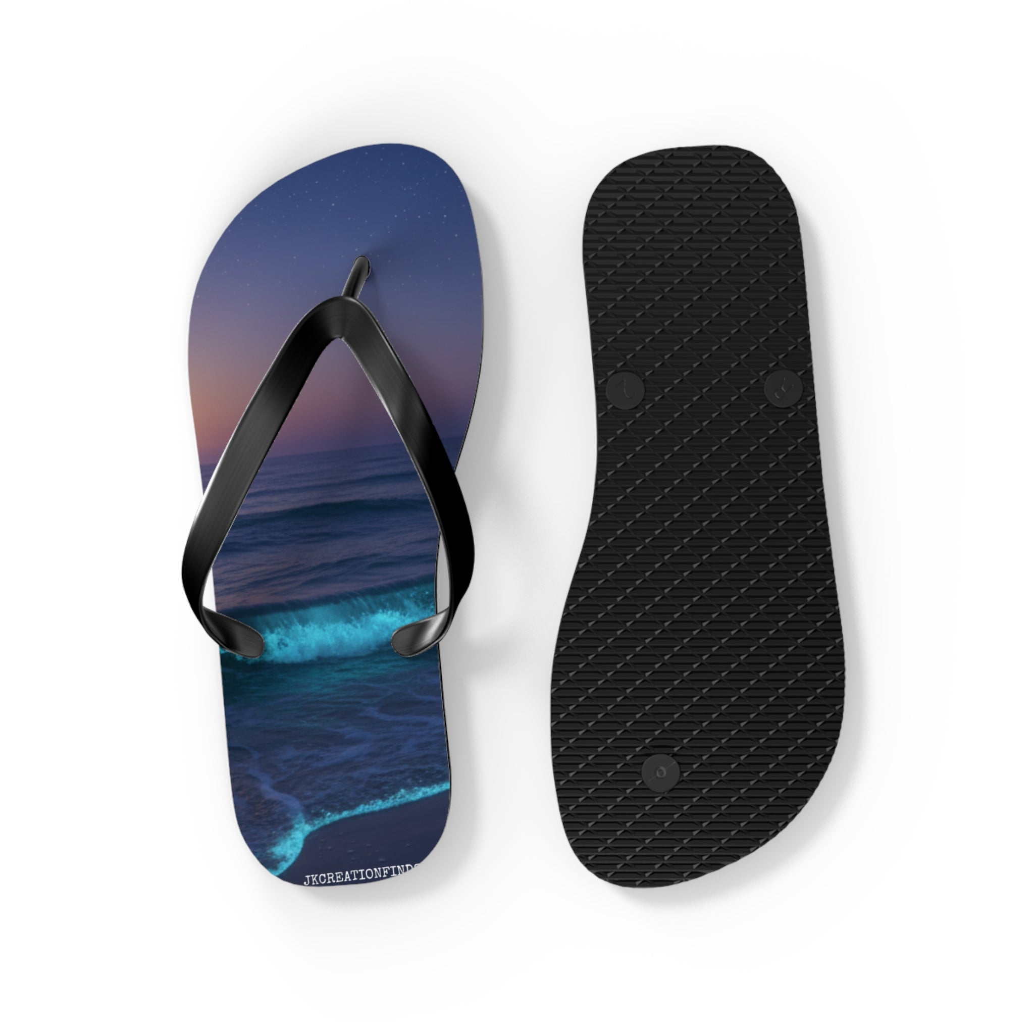 Flip-flops with a nighttime ocean wave print on the left, plain black sole on the right.