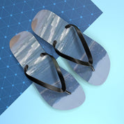 Flip-flops with a landscape print on a blue and white background.