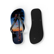 Flip-flops with "LAGUNA BEACH" text and palm tree silhouette at sunset.