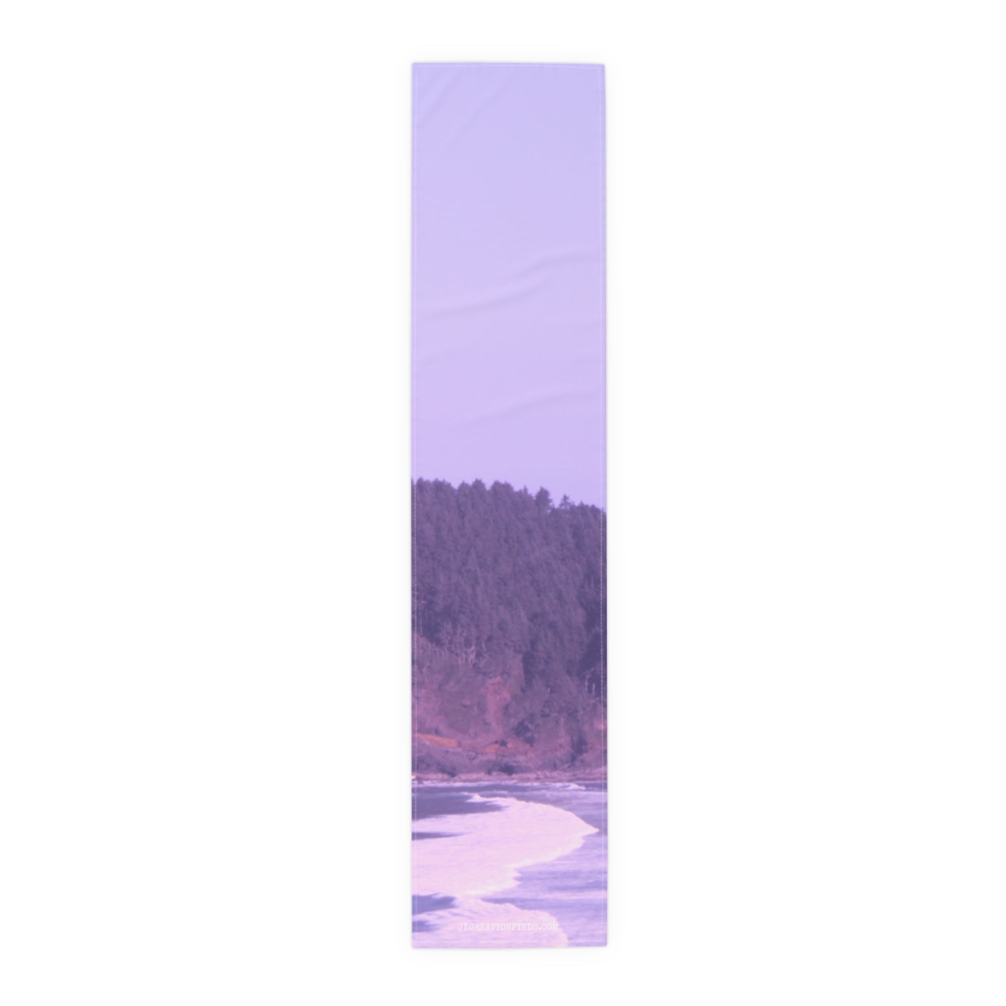 Purple and white scarf featuring a forest and ocean landscape.