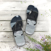 Flip-flops with a scenic water and rock landscape design.