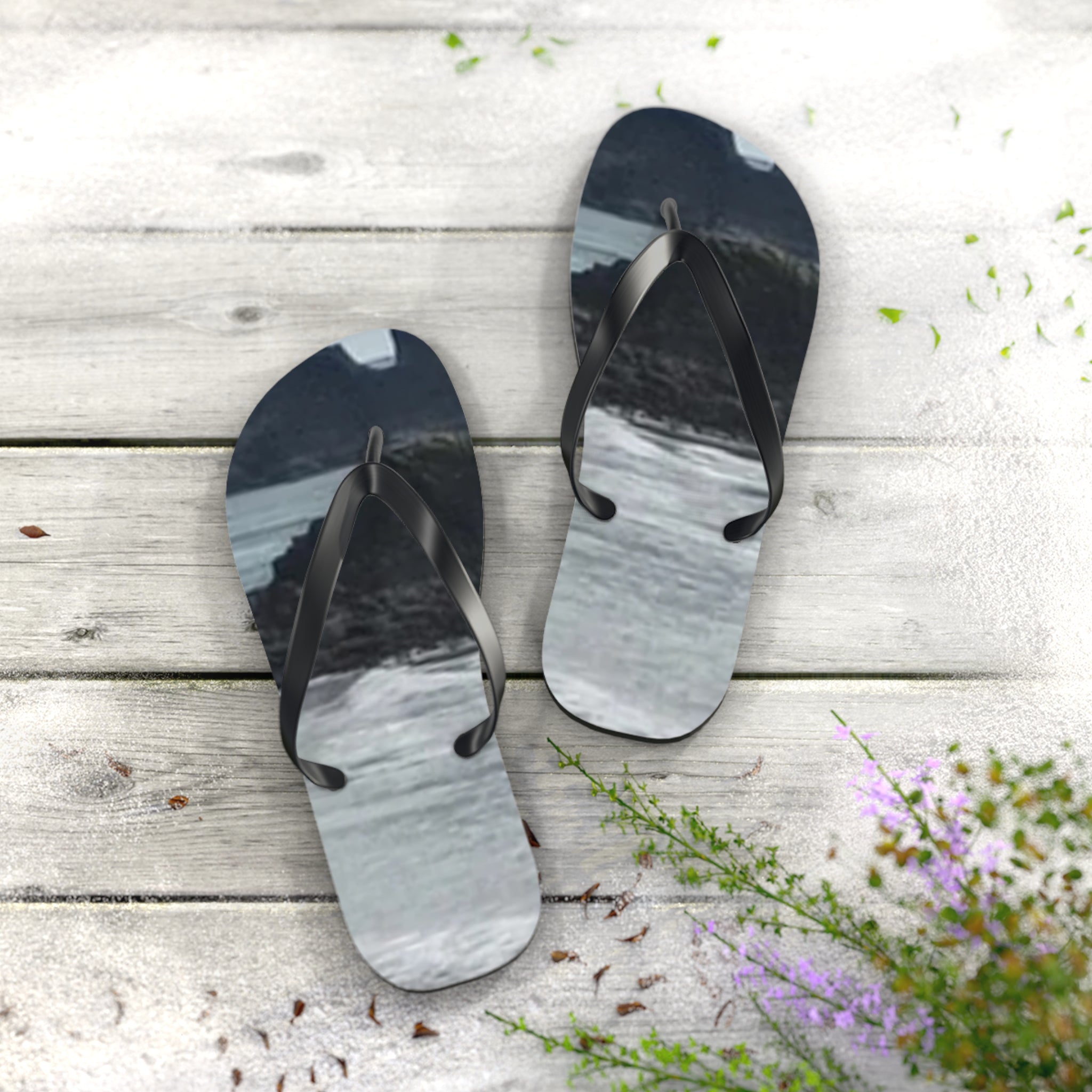 Flip-flops with a scenic water and rock landscape design.