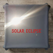 Solar eclipse with bright sun and moon partially obscuring it.