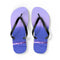 Purple flip-flops with a blue ocean and rock landscape pattern.