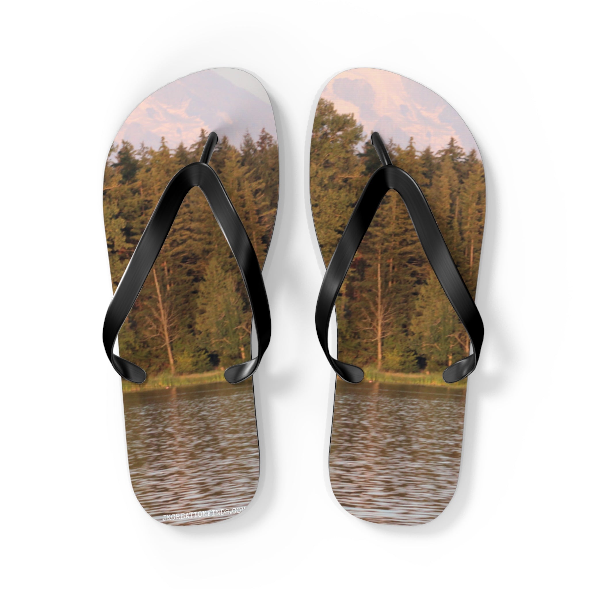 Flip-flops with a forest and lake scene on the soles.