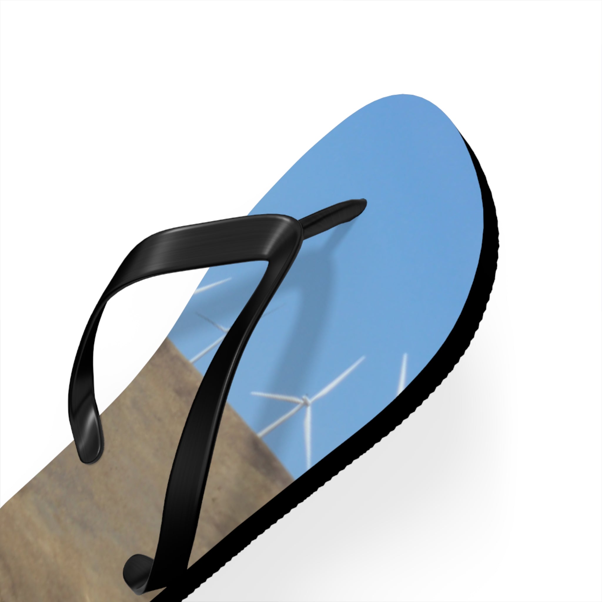 Flip-flops with a wind farm on a blue sky background.