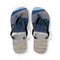 Flip-flops with a landscape scene featuring distant figures on a beach.