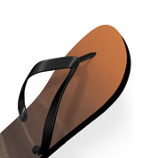 Single black flip-flop with a brown sole on a white background.