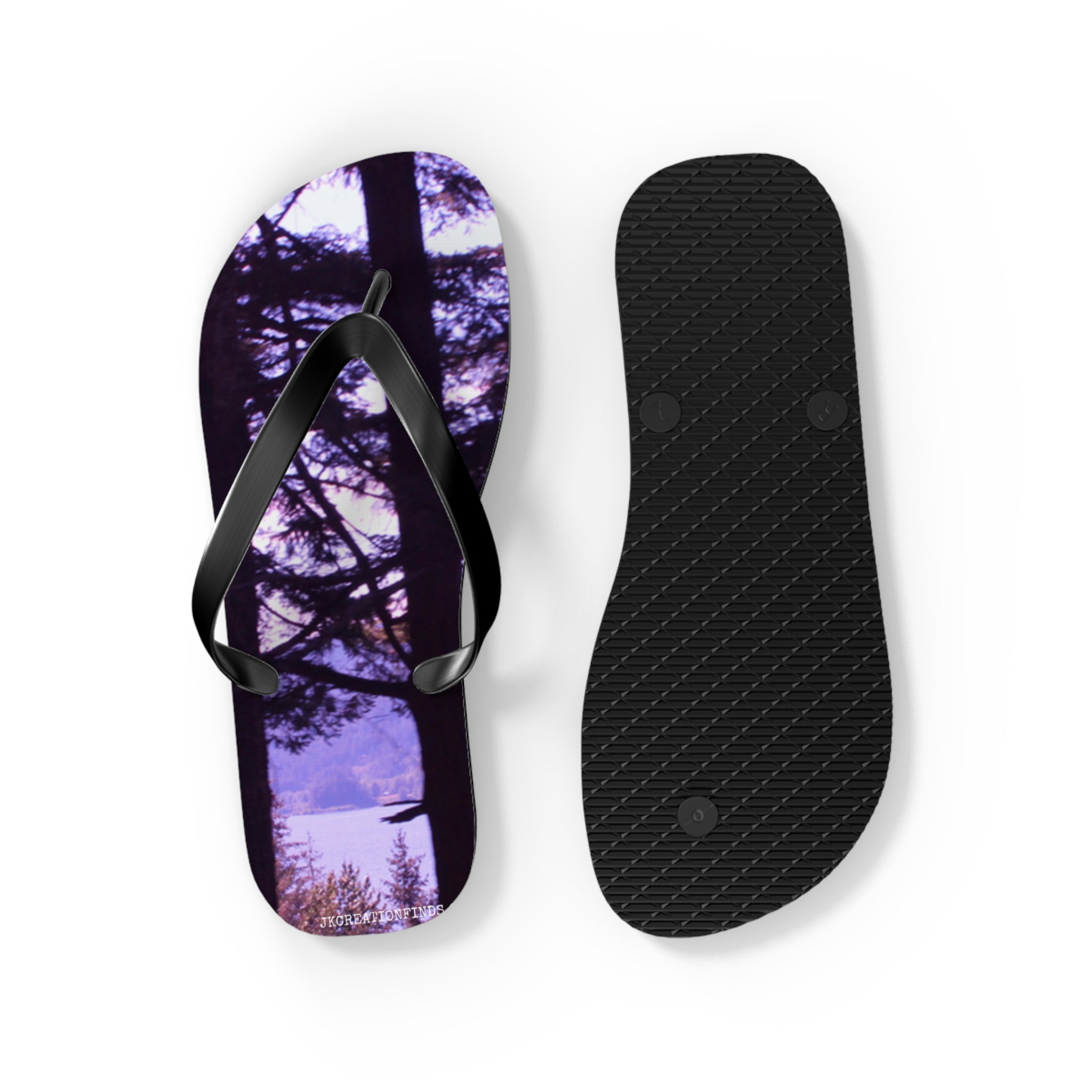 Flip flops featuring a purple forest landscape and trees.