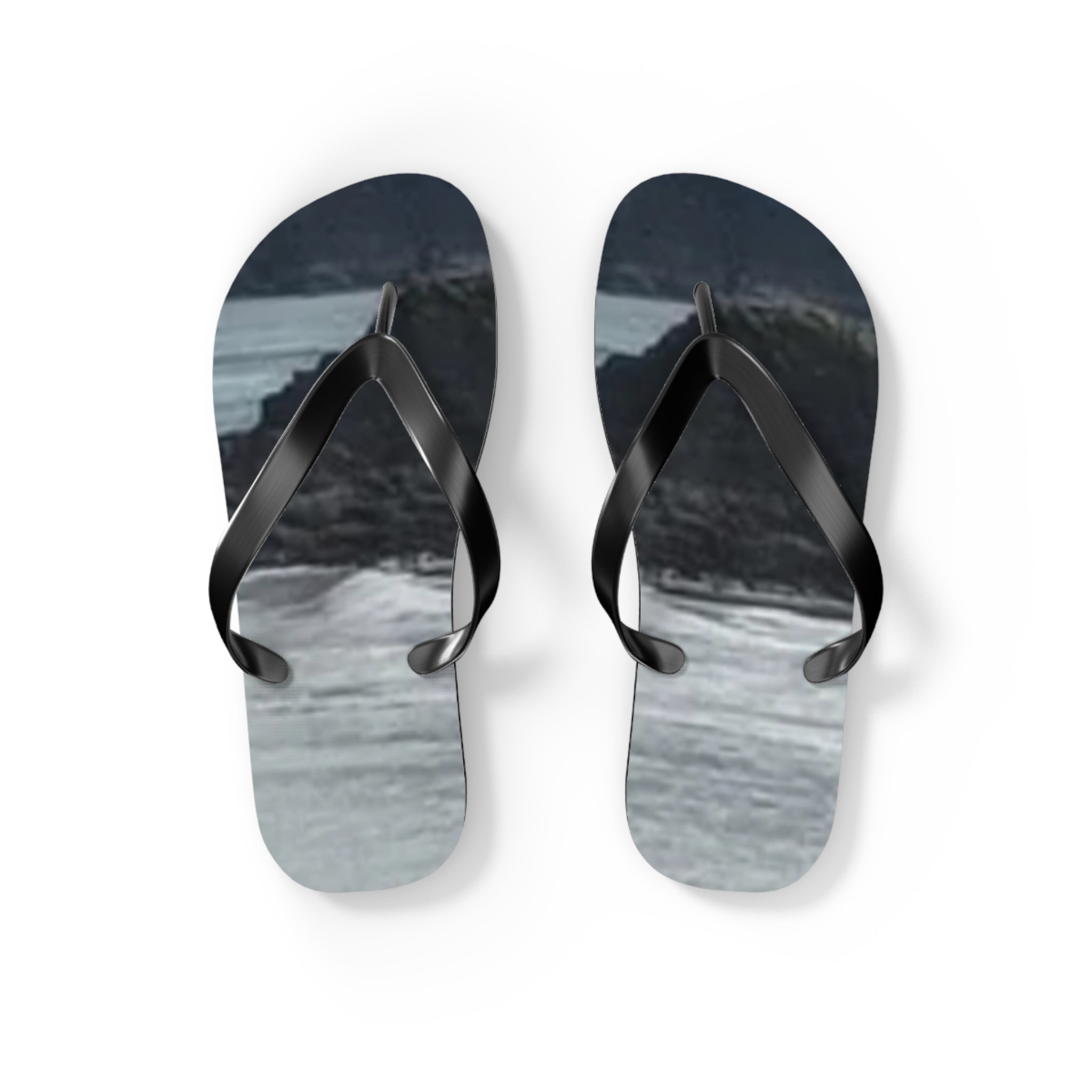 Black flip-flops with a dark, abstract landscape design.