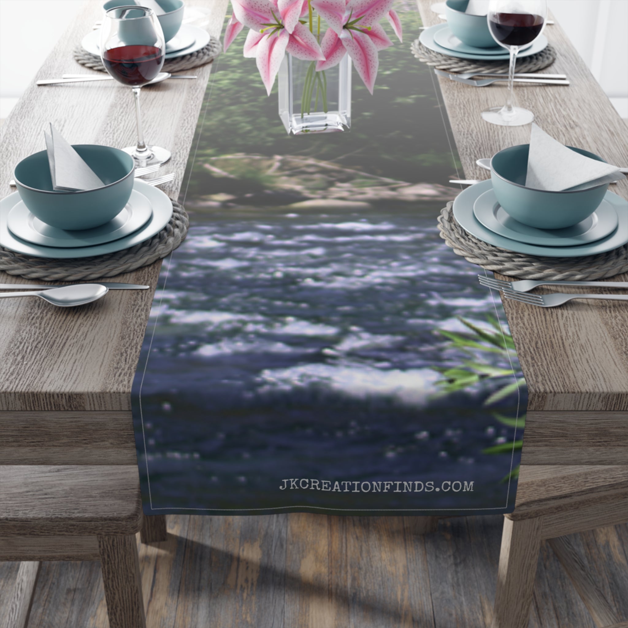 Table runner with blurred river and green foliage design.