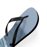 Blue flip-flop with black straps and a wavy water pattern.