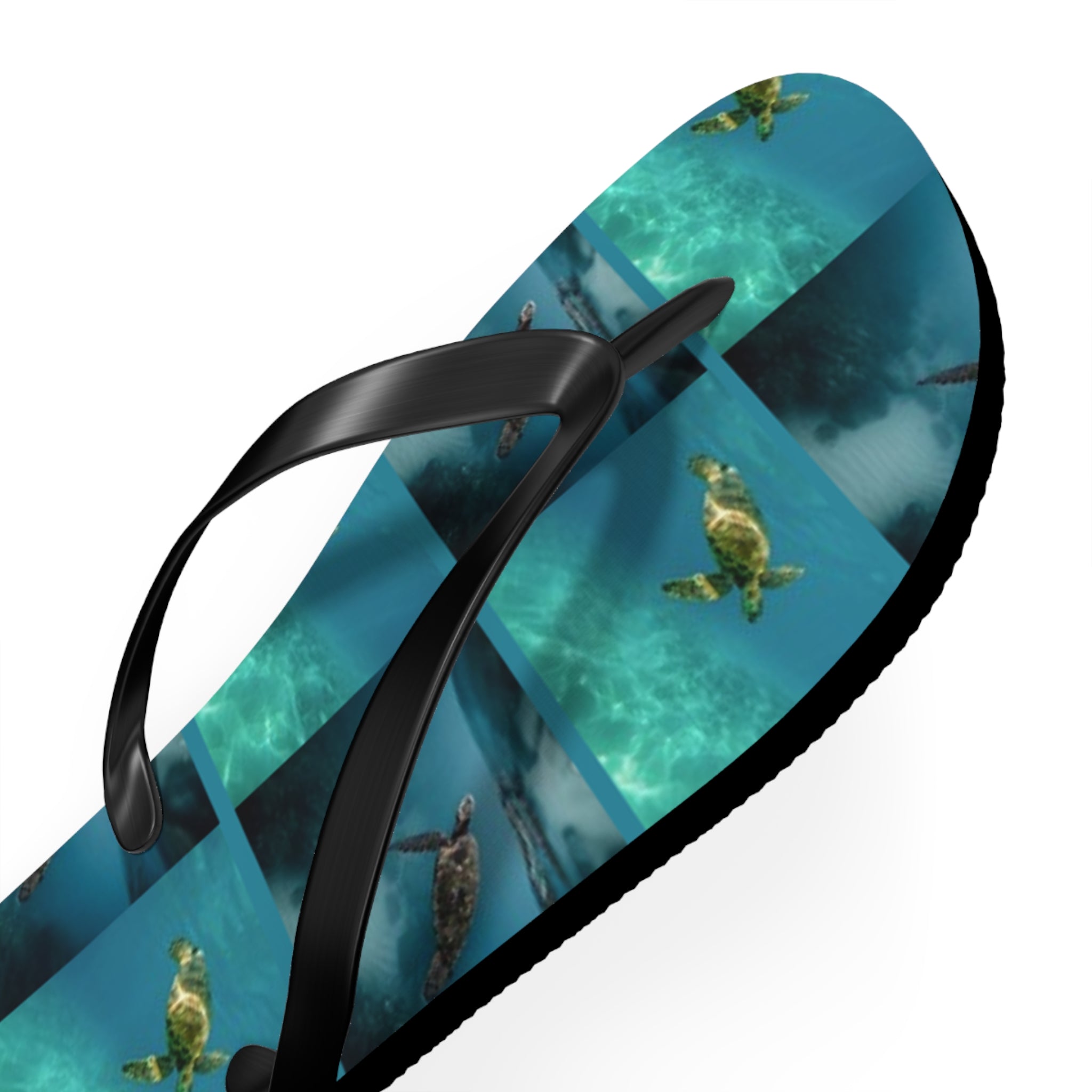 Flip-flops with repeating sea turtle pattern on blue ocean background.