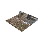 Rolled yoga mat with JKCREATIONFINDS.COM watermark and beach background.