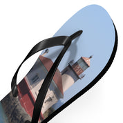 Flip-flops with lighthouse on a sunny day.