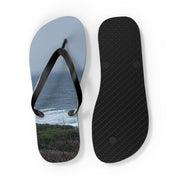 Flip-flops with a scenic ocean and coastal landscape print.