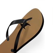 Brown flip-flop with black strap and star shadow on white background.