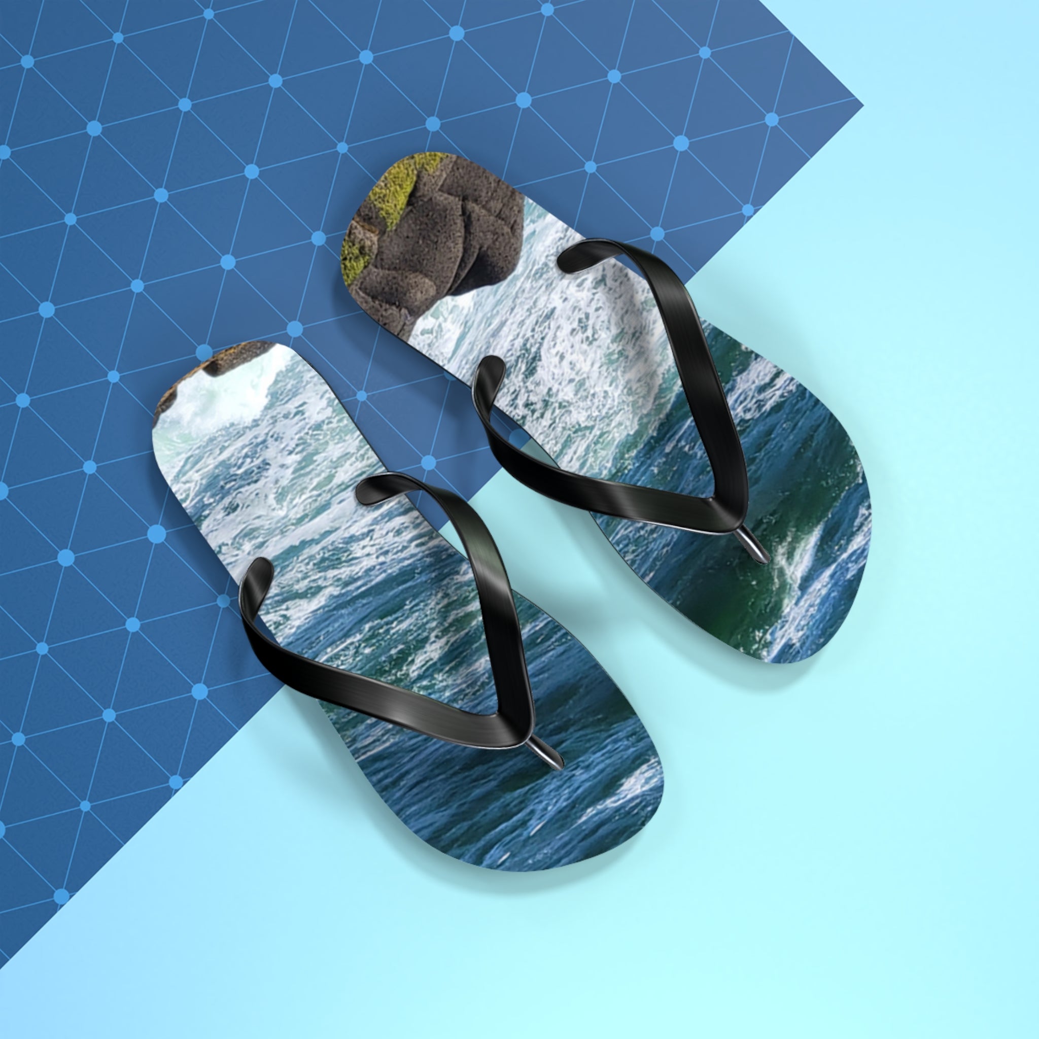 Flip-flops with ocean wave design on a blue and light blue background.