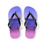 Purple flip-flops with a beach scene featuring a calm ocean and distant people.