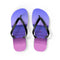 Purple flip-flops with a beach scene featuring a calm ocean and distant people.