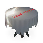 Table draped in a white cloth with "SOLAR ECLIPSE" in red text.