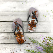 Flip-flops with "Laguna Beach" text and a beach scene on a weathered wooden surface.