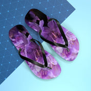 Flip-flops with a purple floral design on a light blue and dark blue background.