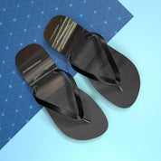 Black flip-flops with website URL on a blue and light blue background.