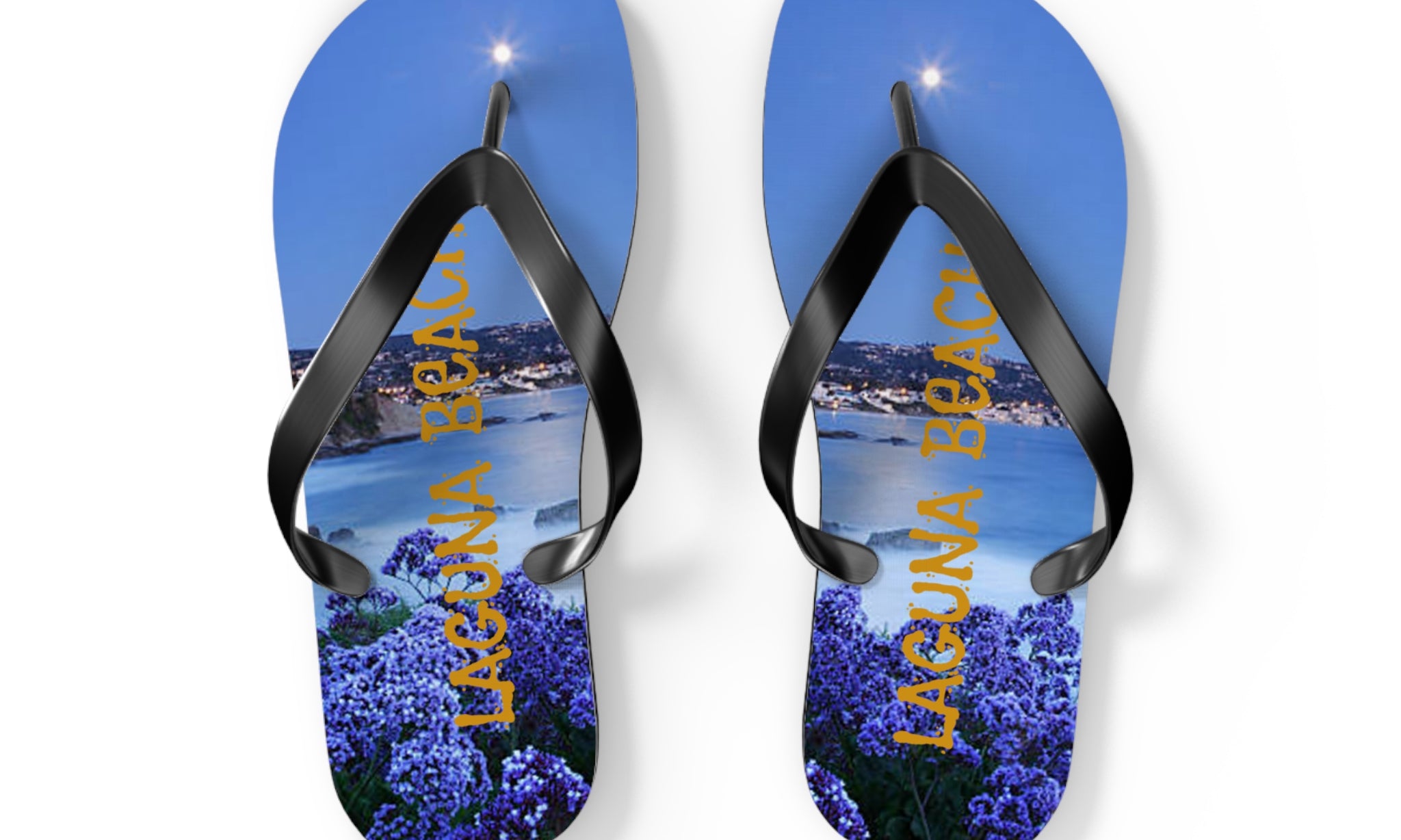 Flip-flops with "Laguna Beach" and purple flowers against a nighttime beach scene.
