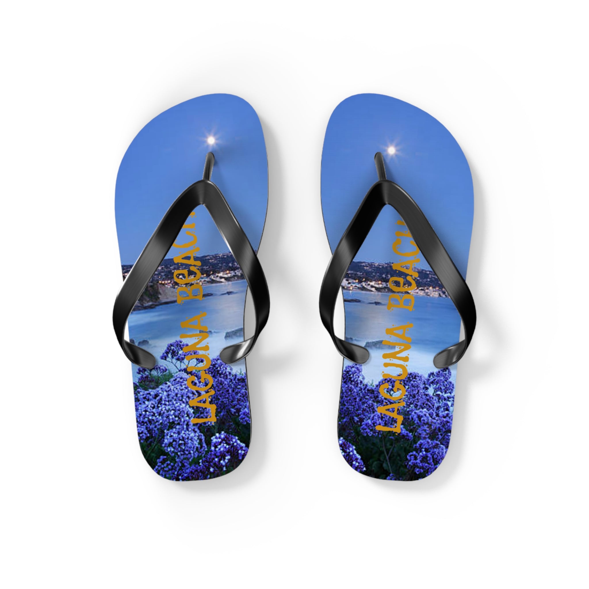 Flip-flops with "Laguna Beach" and purple flowers against a nighttime beach scene.