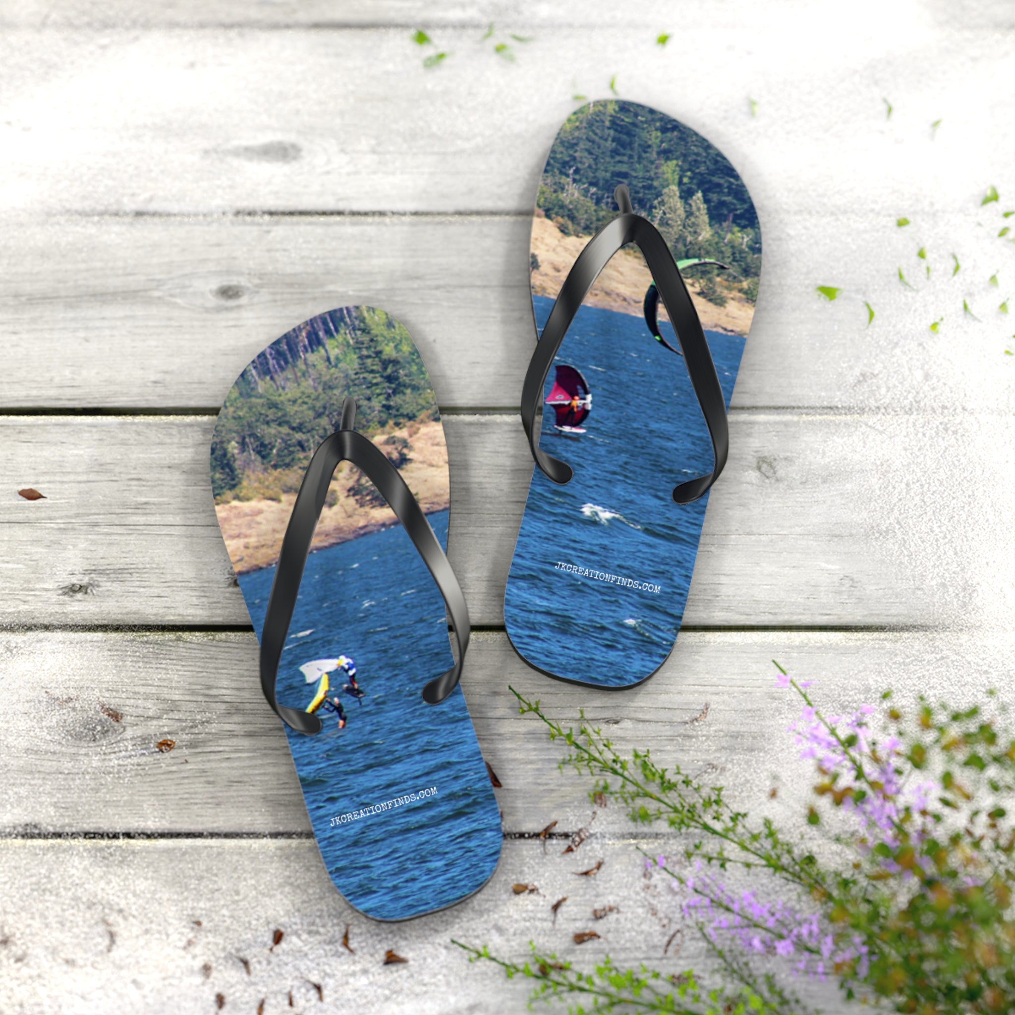Flip-flops with an image of a person BASE jumping over a lake and forest.