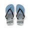 Blue flip-flops with ocean waves on a white background.