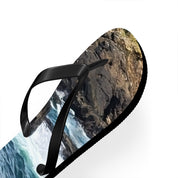 Black flip-flop with a landscape of mountains and water on the sole.
