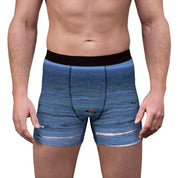 Men's boxer briefs with a blue ocean wave and rock print.