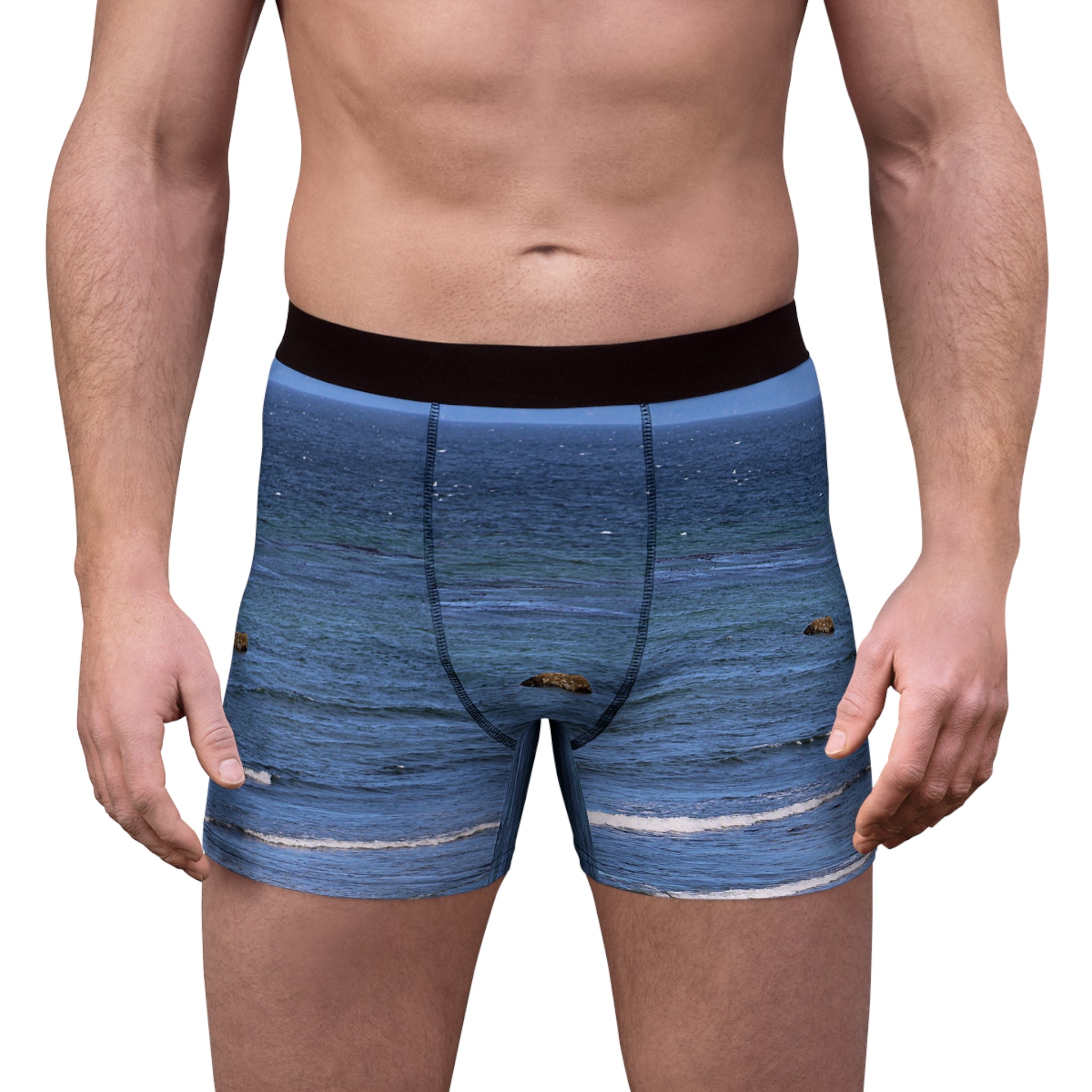 Men's boxer briefs with a blue ocean wave and rock print.